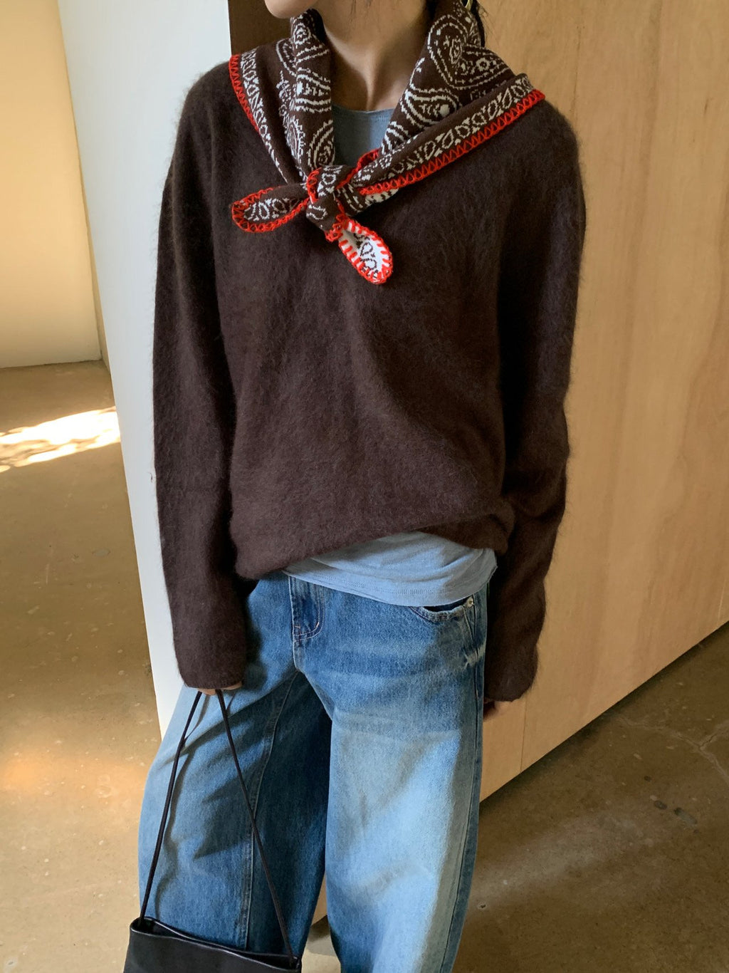 Front view of mocha V-neck knit sweater