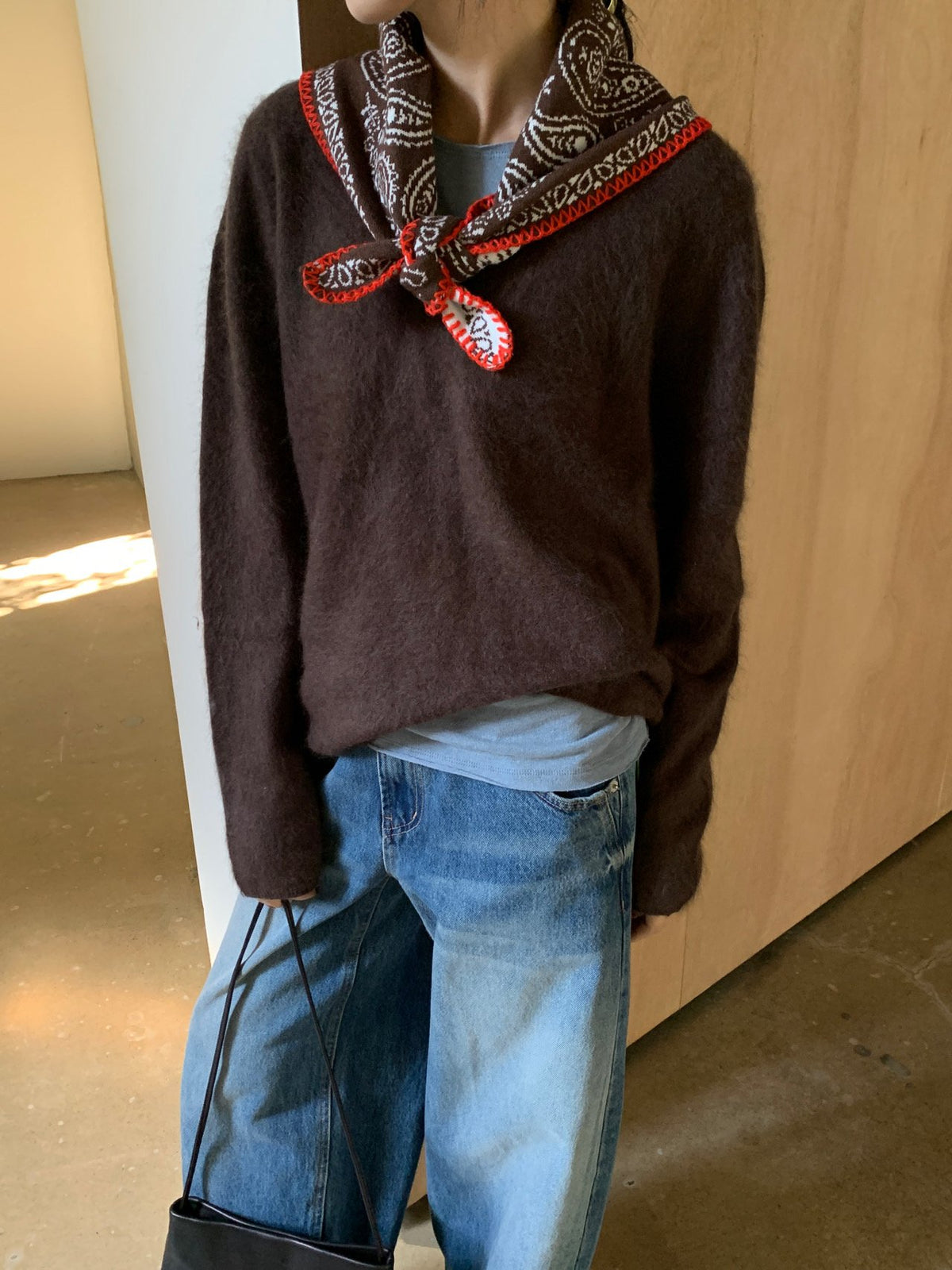 Front view of mocha V-neck knit sweater