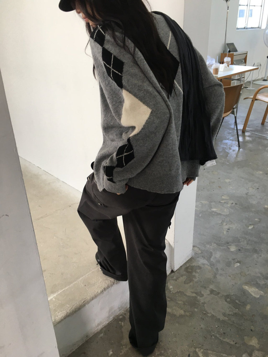 Back view of brown cardigan with blue diamond argyle pattern
