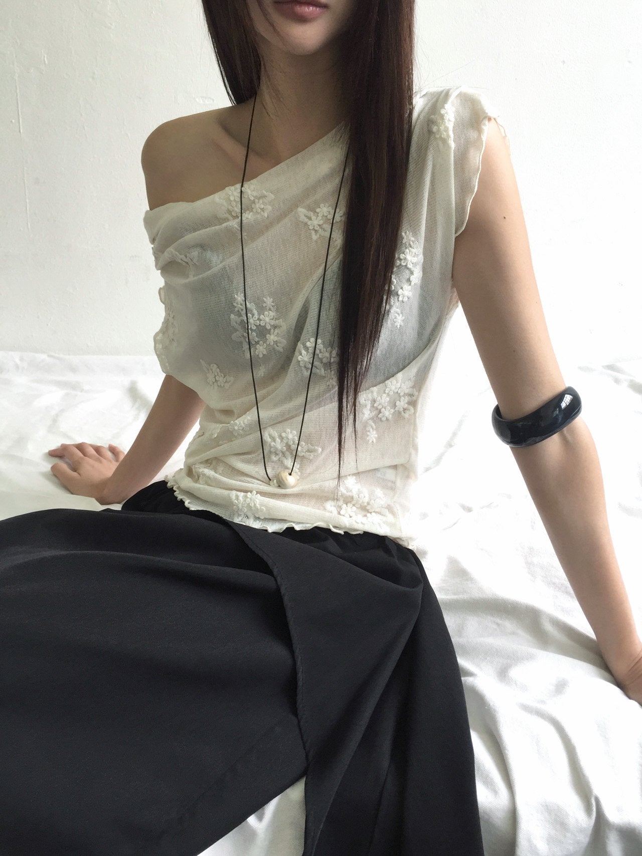 Nweol one-shoulder floral lace mesh top in Cream Ivory, product flat lay front view on white surface