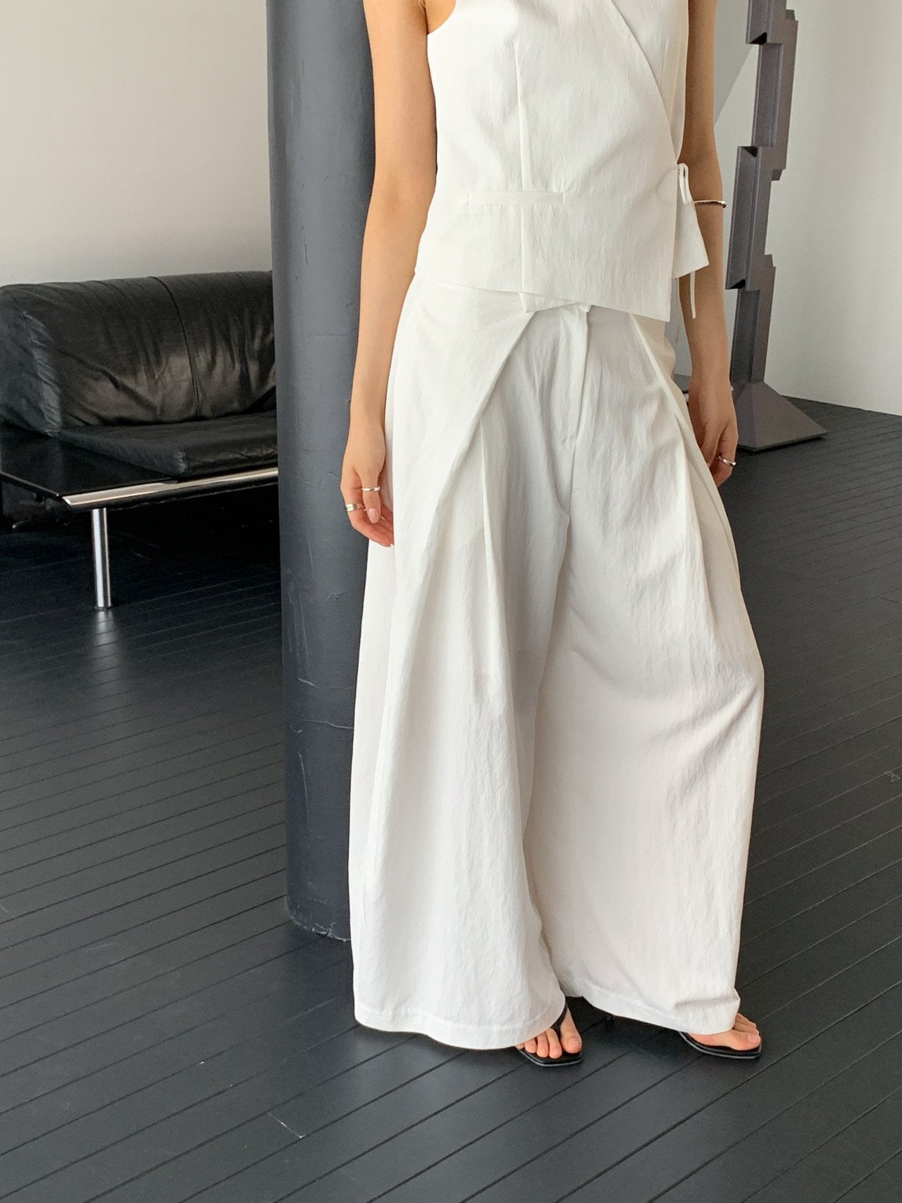 Vivel high waist deep pleat wide leg pants in White, styled on model side view with white wrap top full length