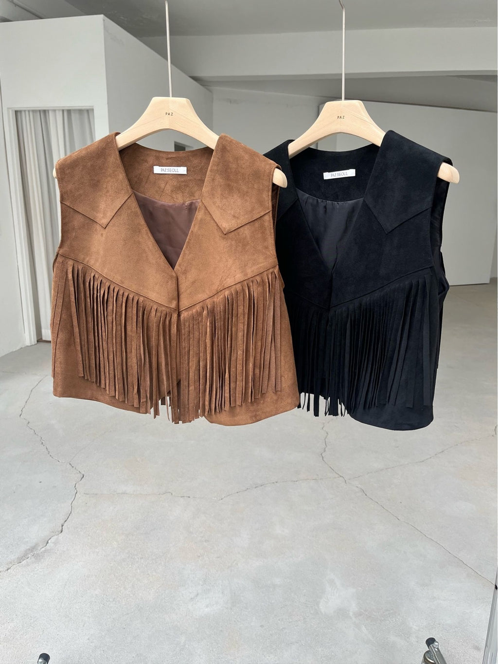 Suede Fringe Vest Black and Camel front on hanger